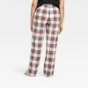 Women's Holiday Tartan Plaid Fleece Matching Family Pajama Pants - Wondershop™ Cream